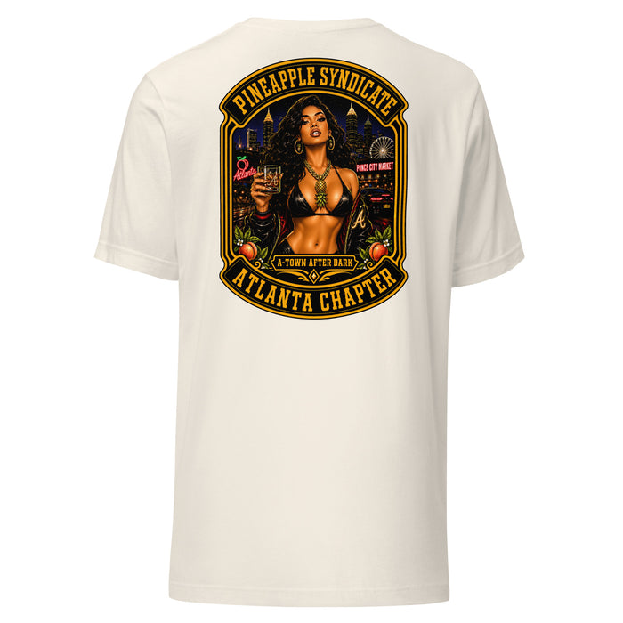 Pineapple Syndicate Atlanta Chapter tee featuring a pinup holding a whiskey glass with Atlanta skyline, Ponce City Market, peach details, A-Town After Dark badge, and black-and-gold framing.