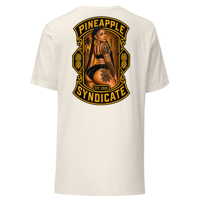 Pineapple Syndicate Braidz tee featuring a tattooed pinup with long braids, black-and-gold framing, pineapple side icons, and a city backdrop.