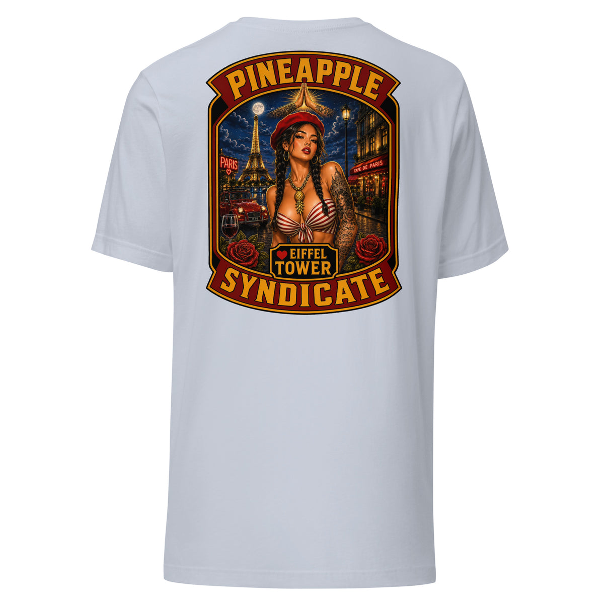Pineapple Syndicate Eiffel Tower tee featuring a French pinup in a red beret with Eiffel Tower backdrop, Paris café scene, roses, wine glass, and bold red-and-gold framing.