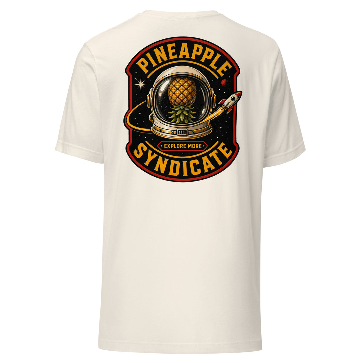 Pineapple Syndicate Explore More Signal tee featuring a space helmet with a floating pineapple inside, rocket detail, starfield backdrop, Explore More badge, and bold black, gold, and red framing.