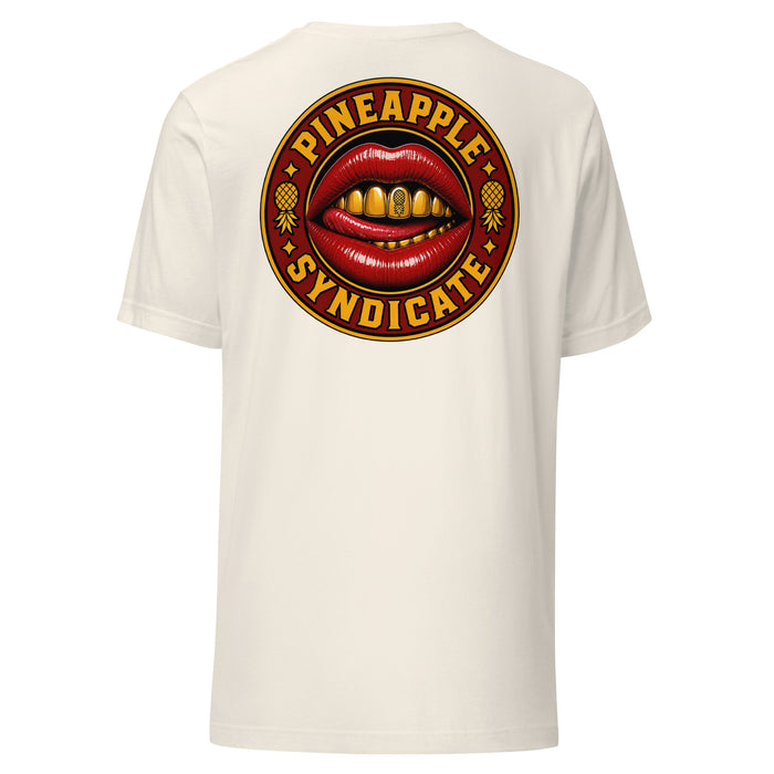 Pineapple Syndicate Gold Grill Signal tee featuring glossy red lips with a gold grill, pineapple tooth detail, pineapple side icons, and bold red-and-gold circular framing.