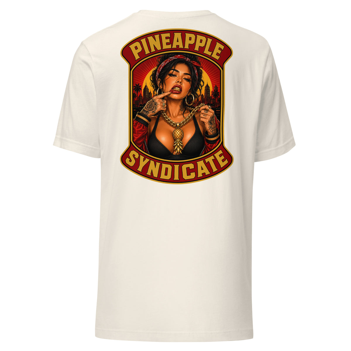 Pineapple Syndicate tee featuring a tattooed pinup with a gold grill, heavy gold chain with pineapple pendant, city skyline, and bold red-and-gold framing.