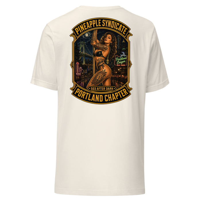 Pineapple Syndicate Portland Chapter tee featuring a tattooed pinup on a pole with 503 After Dark badge, Portland Oregon neon, bridge skyline, Voodoo Doughnut sign, and bold black-and-gold framing.