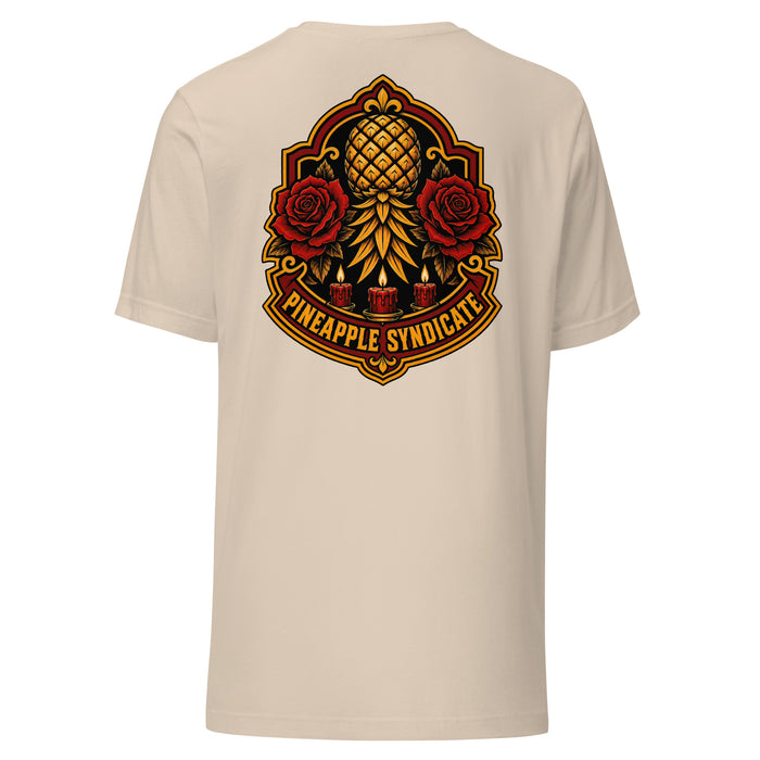 Pineapple Syndicate Sacred Pineapple Crest tee featuring a golden pineapple centerpiece with red roses, candle accents, ornate red-and-gold framing, and bold emblem styling.
