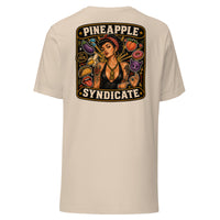 Pineapple Syndicate Speak in Code tee featuring a tattooed pinup with gold pineapple pendant surrounded by playful coded icons, emoji-style graphics, and bold black-and-cream framing.