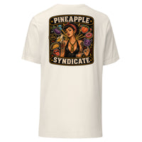 Pineapple Syndicate Speak in Code tee featuring a tattooed pinup with gold pineapple pendant surrounded by playful coded icons, emoji-style graphics, and bold black-and-cream framing.