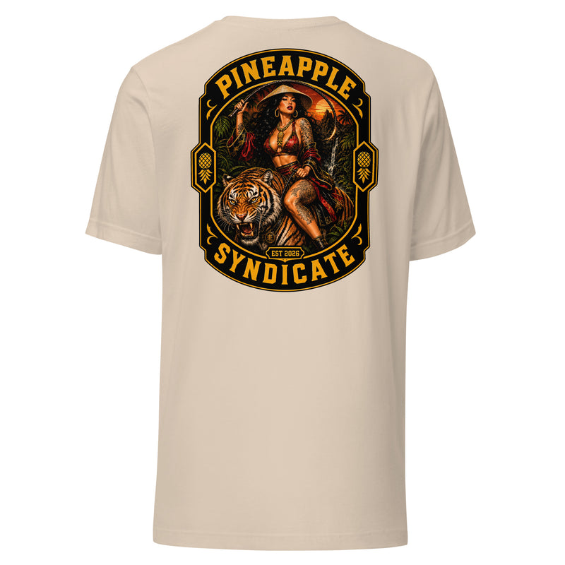 Pineapple Syndicate Tiger Style tee featuring a tattooed pinup riding a roaring tiger, jungle sunset backdrop, upside down pineapple side icons, and bold black-and-gold framing.