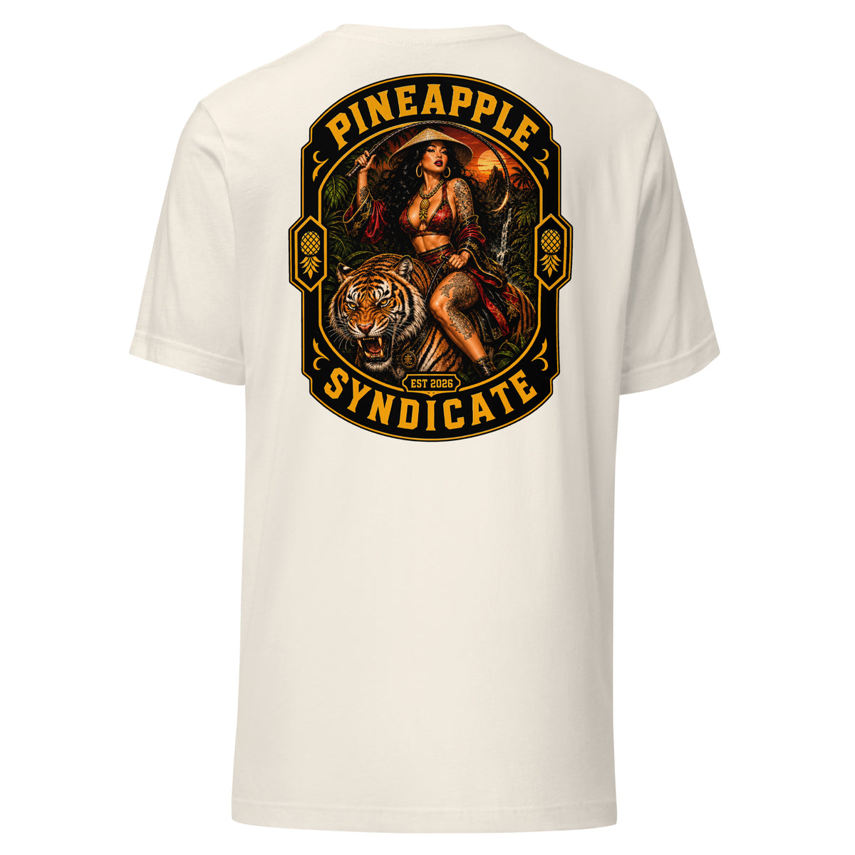 Pineapple Syndicate Tiger Style tee featuring a tattooed pinup riding a roaring tiger, jungle sunset backdrop, upside down pineapple side icons, and bold black-and-gold framing.