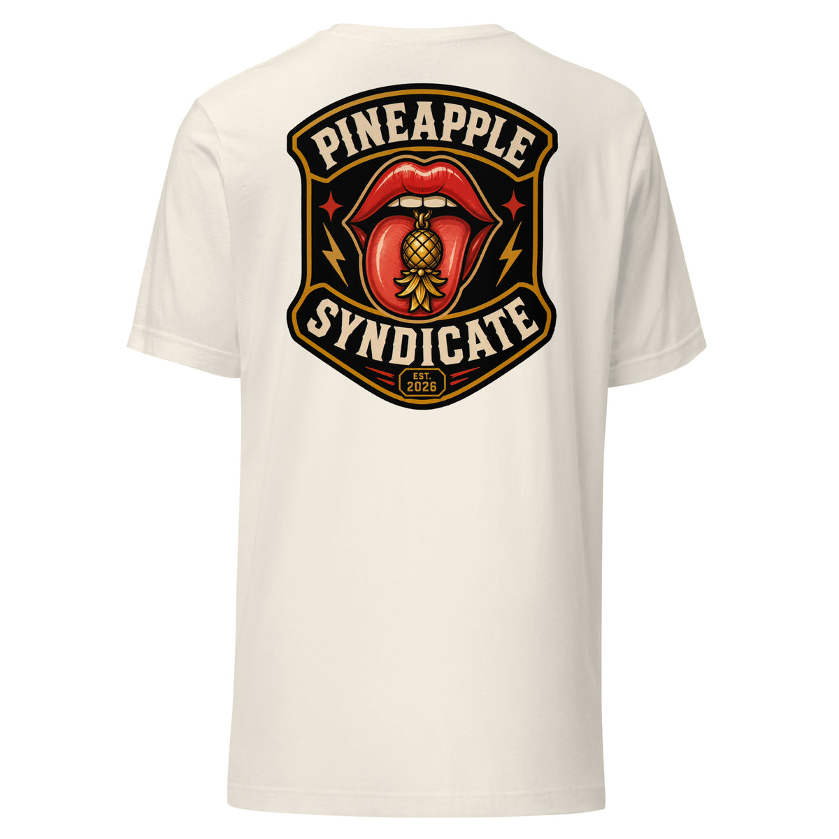 Pineapple Syndicate Quiet Signals tee featuring glossy red lips with a gold pineapple tongue charm, lightning-bolt accents, Est. 2026 badge, and bold black-and-cream framing.