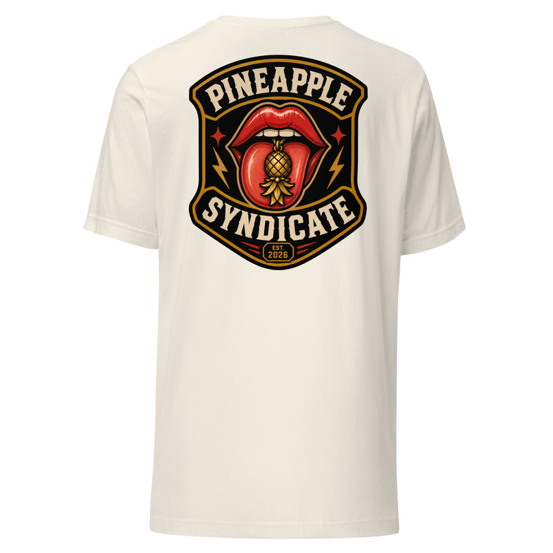 Pineapple Syndicate Quiet Signals tee featuring glossy red lips with a gold pineapple tongue charm, lightning-bolt accents, Est. 2026 badge, and bold black-and-cream framing.